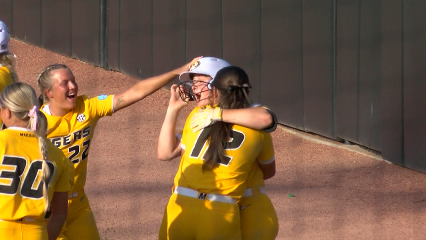 Mizzou's Madison Walker celebrated with her teammates after walking off MU's NCAA Regional Final game against Omaha to send her team to Super Regionals. 